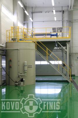 Filter press with a sludge water storage tank